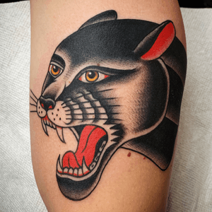 Tattoo by @zimovan. #panther #bright #BoldTattoos #brightandbold #traditional #traditionaltattoo #folktraditional #color #eye #cat #oldschool #AmericanTraditional #americana #classictattoos 