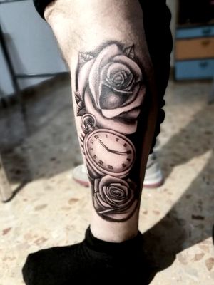 Roses and clock tattoo