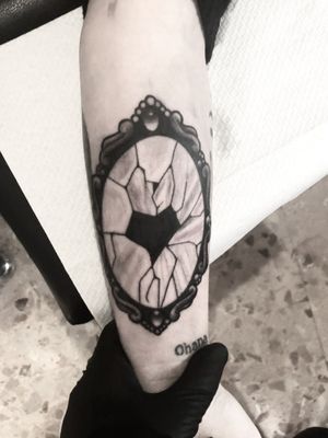 Broken mirror tattoo