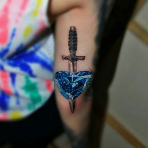 Realistic tattoo with dagger and diamond heart. #heart #diamond #dagger #daggertattoo #realistic #realism 