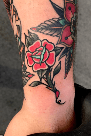 Drawn on traditional filler rose tattoo 
