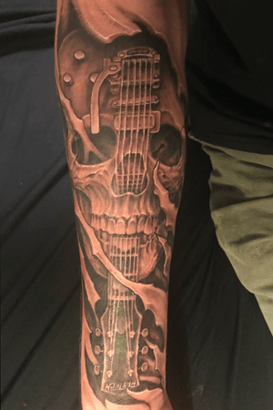 The first piece on my sleeve. A gretsch pro jet solid body with a skull incorperated