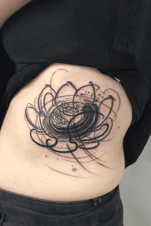 Lotus on ribs from Good Times Tattoo