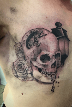 Skull, roses, clock and lantern, partial scar cover up. 