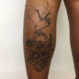 Tattoo by WolfGore #Wolfgore #TannParker #InktheDiaspora #bat #horseshoe #flowers #floral #nature #qpocttt #poctattoo #qpoctattoo #brownskin #blackskin #empower #visibility #tattoocommunity