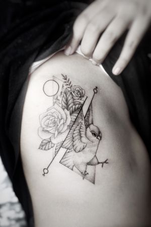 Girly tattoo on the rib