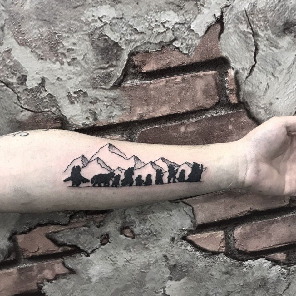 Lotr tattoo. The fellowship in front of Mt. Cook. Dot work by