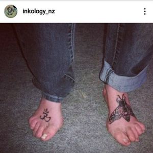 om symbol and gypsy moth foot tattoos