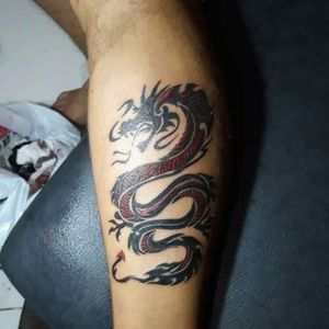 tribal black and red dragon tattoo