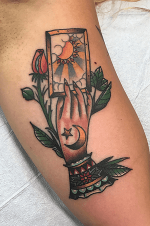 Traditional Gypsy hand and tarot card and rose on a bicep 