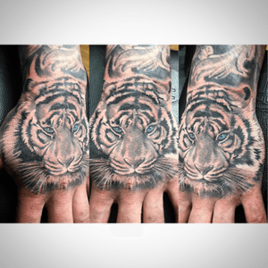 Tattoo uploaded by Brandon Shuman • Tiger hand • Tattoodo