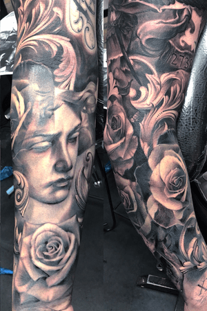 Sculpture roses and filigree black and gray sleeve.