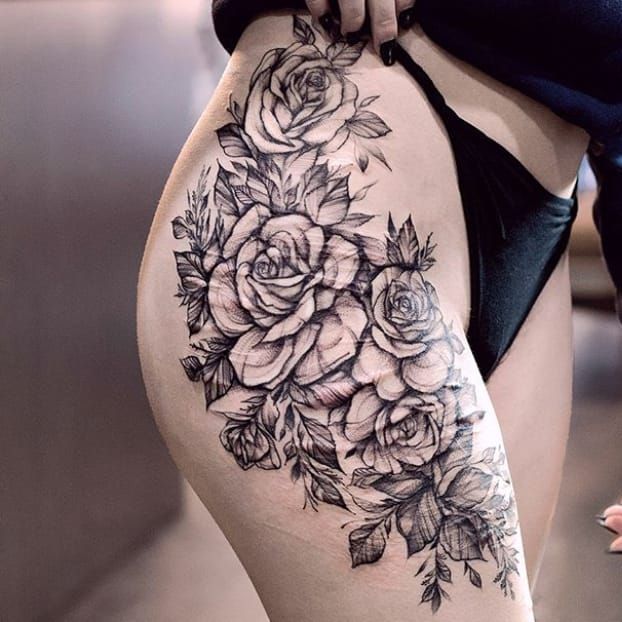 Delicate flower rose tattoo on a hip single needle