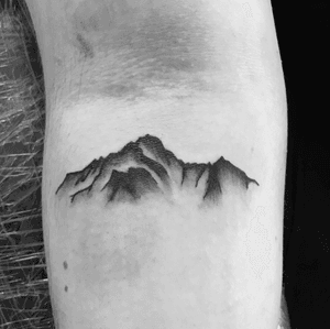 Small tattoo of a mountain #blackandgray #smalltattoo #blackwork #mountain #armtattoo 