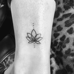 Small tattoo of a lotus #lotusflower #linework #blackwork #blackandgray #legtattoo