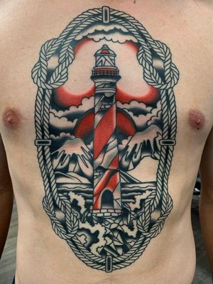 Tattoo by Jesse Ray Tattoos #JesseRayTattoos #besttattoos #favoritetattoos #awesometattoos #tattoodoapp #tattooartist #tattoodoappartists #traditional #lighthouse #landscape #Mountains #sky #rope #sailor