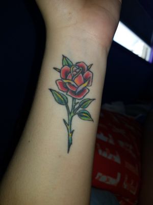 Colored Rose done by Moses Saarni at Black Heart Tattoo in SF. 