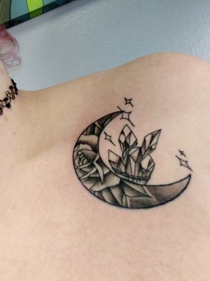 this is a tattoo I got with a long time friend, she brought up the idea. they're both moons with crystals but they're also tailored to our personalities, which I really love.