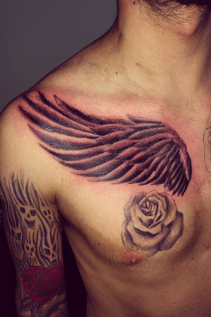 Custom wings on chest. Rose healed done a few weeks ago. 