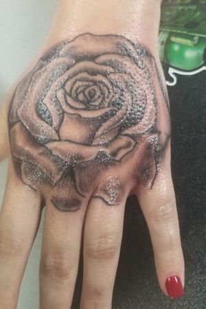 Rose on hand