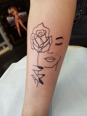 Face and rose line tattoo