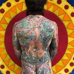 Tattoo by Chad Koeplinger #chadkoeplinger #SurrealTraditionalTattoos #Traditionaltattoos #surrealtattoos #surrealism #oldschool #AmericanTraditional #buddhism #skull #hindu #dragon #rainbow #tibetan #backpiece