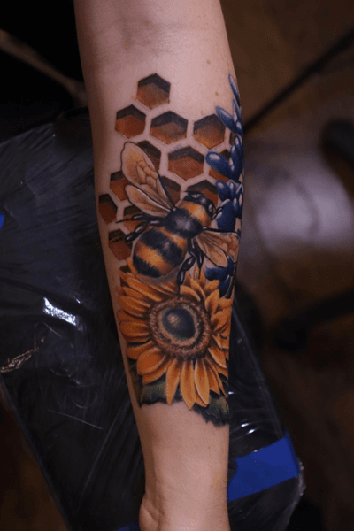 Bee, sunflower, and bluebonnet