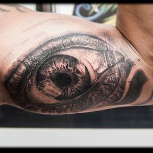 Eye tattoo on the inner biceps. #eye #realism #black and grey