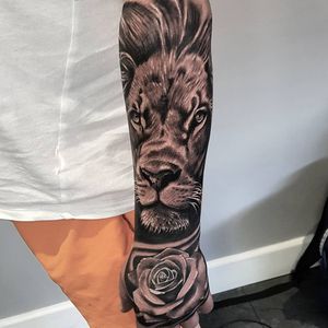 Lion and hand tattoo realistic black and grey tattoo #blackandgreytattoo #blackandgrey #realistic  #realism #realistictattoo #blackandgraytattoo  #blackandgraytattoos #liontattoo #lion #blackandgraytattoos #tattoo 