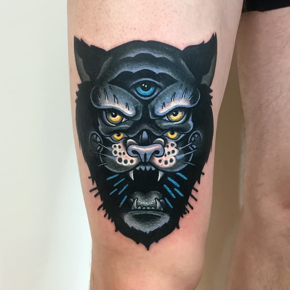 Traditional style black panther tattoo on the chest