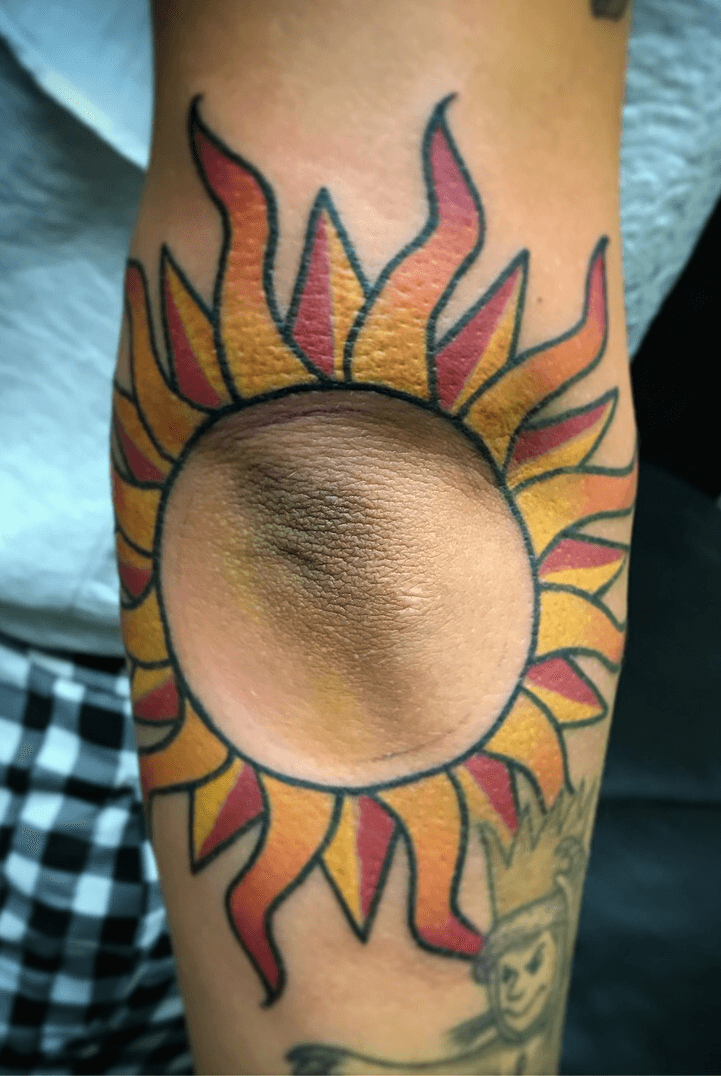 Black Tribal Sun Elbow Tattoo