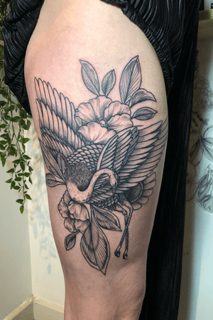 Crane and floral design on thigh 