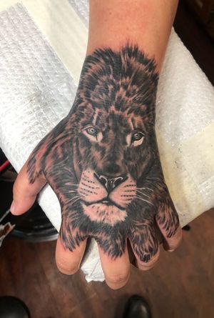 Killer lion hand tattoo, done by Slinger!