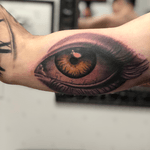 Realistic eyeball tattoo. 