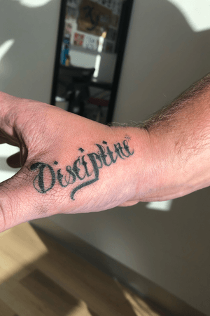 Discipline thumb/hand tattoo