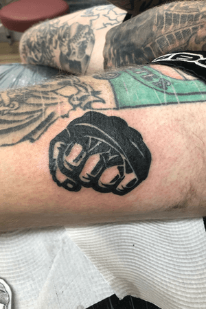 Mma style fist tattoo 