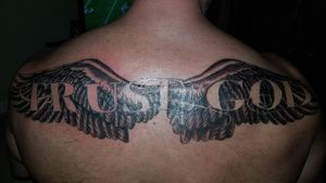 Trust god free hand tattoo