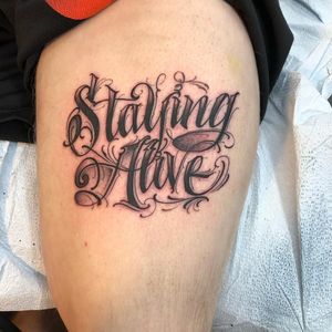 Upper leg tattoo by BJ Betts #BJBetts #letteringtattoos #lettering #text #font #type #calligraphy #script #letters #quotes #words