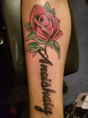 A lil name with a neo traditional rose