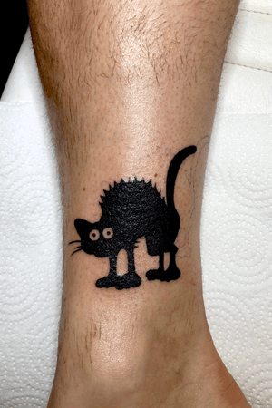 scared black cat tattoo