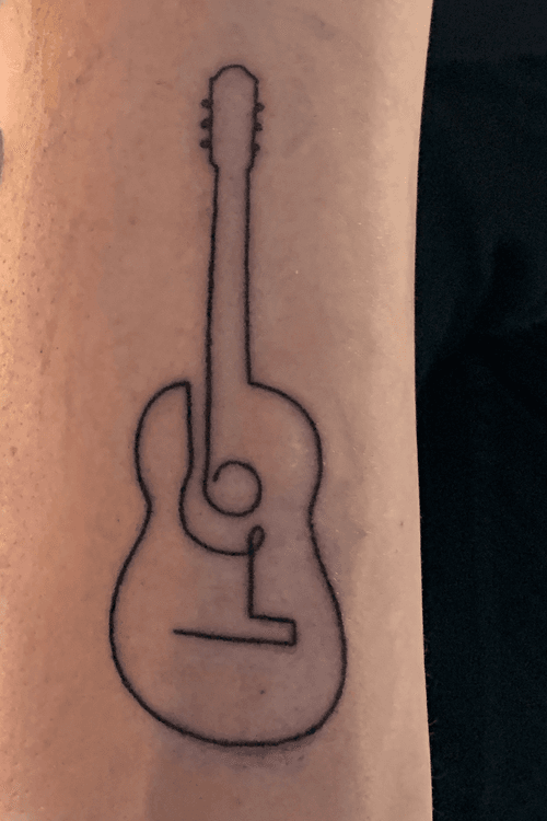 Acoustic guitar. Done by Fabienne Demmer at Lucky Charm Tattoo, Nijkerk, Netherlands at April 19, 2019.