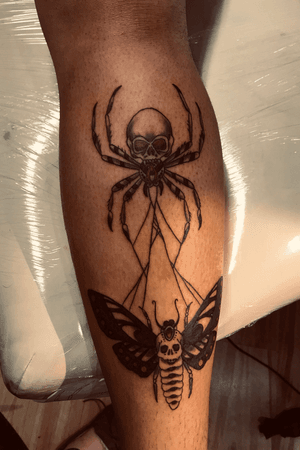 Spider skull and death moth tattoo in web 