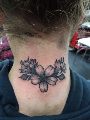 Little floral piece done on the back of the neck.