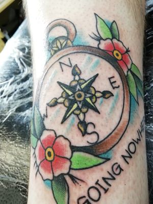 Traditional style compass, text says "going nowhere". 