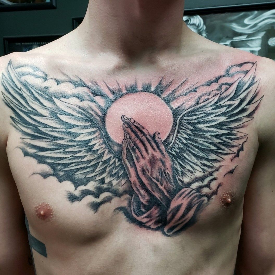 praying hands tattoo with angel wings