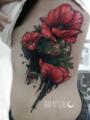 Poppy flowers cover up tattoo