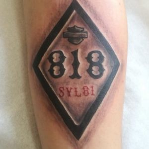 My first tattoo done by the VP of HAMC Barcelona the 818 is my lucky number and SYL81 is support your local 81 but also of course the Harley badge 