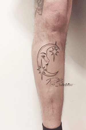 Unique illustrative tattoo by artist Patrick Bates on the shin, featuring a stunning moon and star motif.