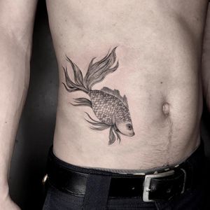 Fish tattoo by Ulises Indio #UlisesIndio #fishtattoo #fishtattoos #fish #seacreature #oceanlife #animal #ocean #water #pisces #nature #illustrative #fineline #linework #blackandgrey #stomachtattoo
