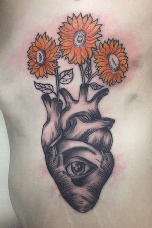 Illustrative human heart with sunflowers on the ribs 